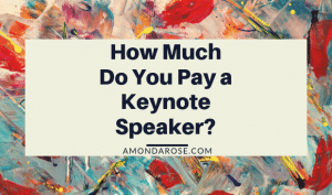 white banner on top of a colorful image, how much do you pay a keynote speaker